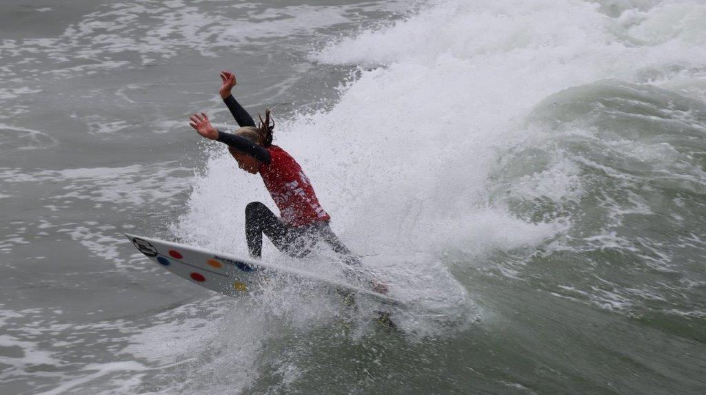 A person surfing on a wave

Description automatically generated