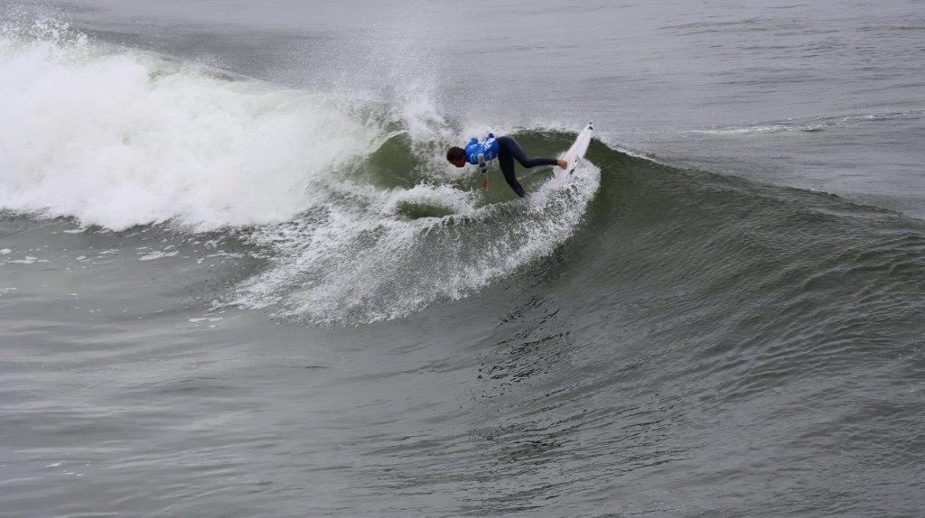 A person surfing on a wave

Description automatically generated
