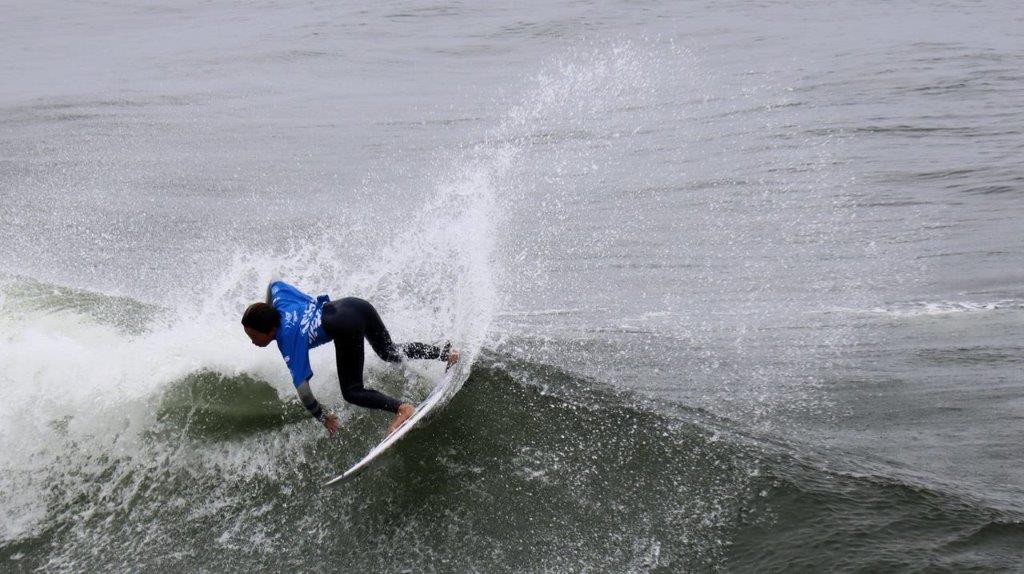 A person surfing on a wave

Description automatically generated