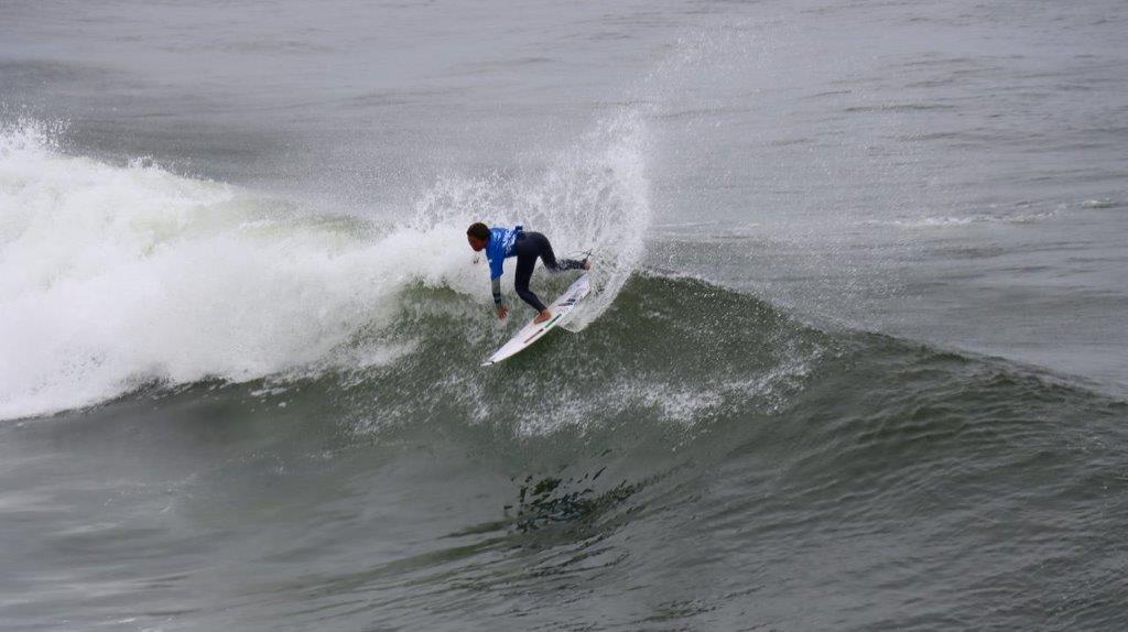 A person surfing on a wave

Description automatically generated
