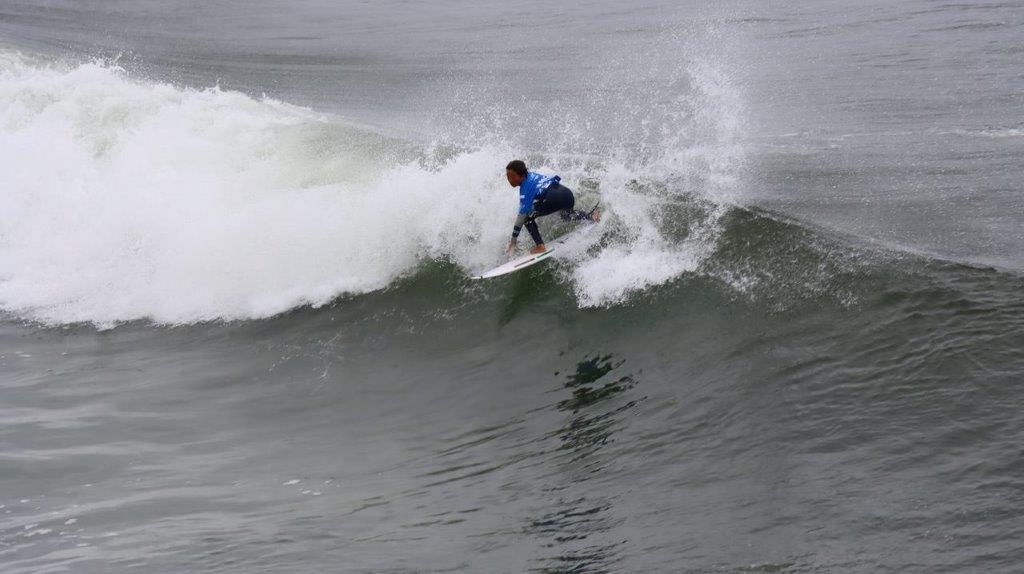 A person surfing on a wave

Description automatically generated