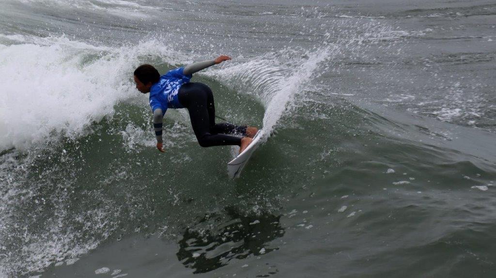 A person surfing on a wave

Description automatically generated