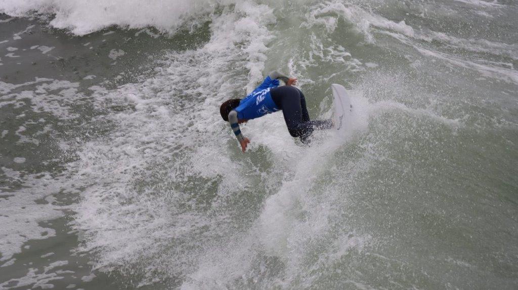 A person surfing on a wave

Description automatically generated