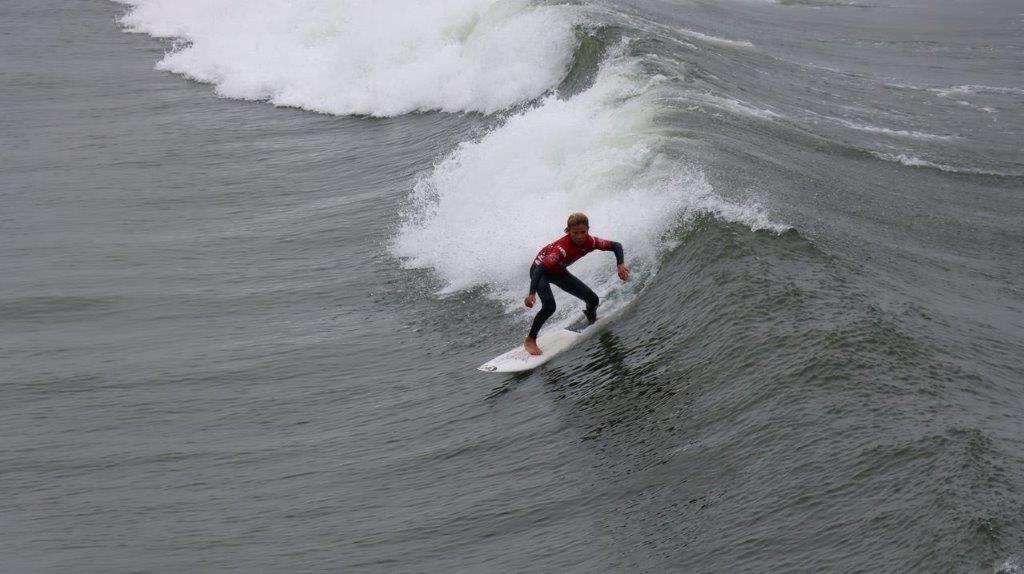 A person surfing on a wave

Description automatically generated
