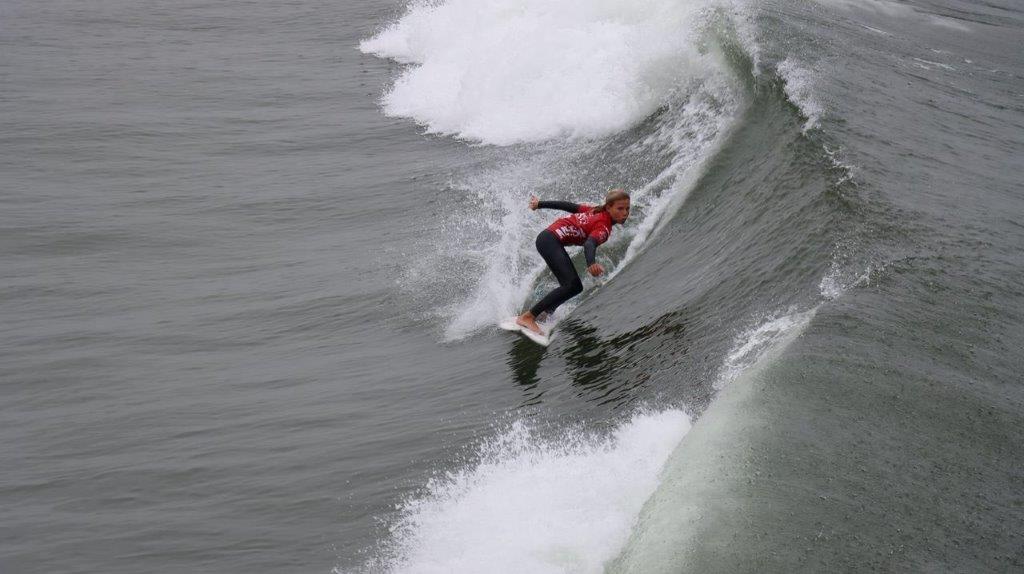 A person surfing on a wave

Description automatically generated