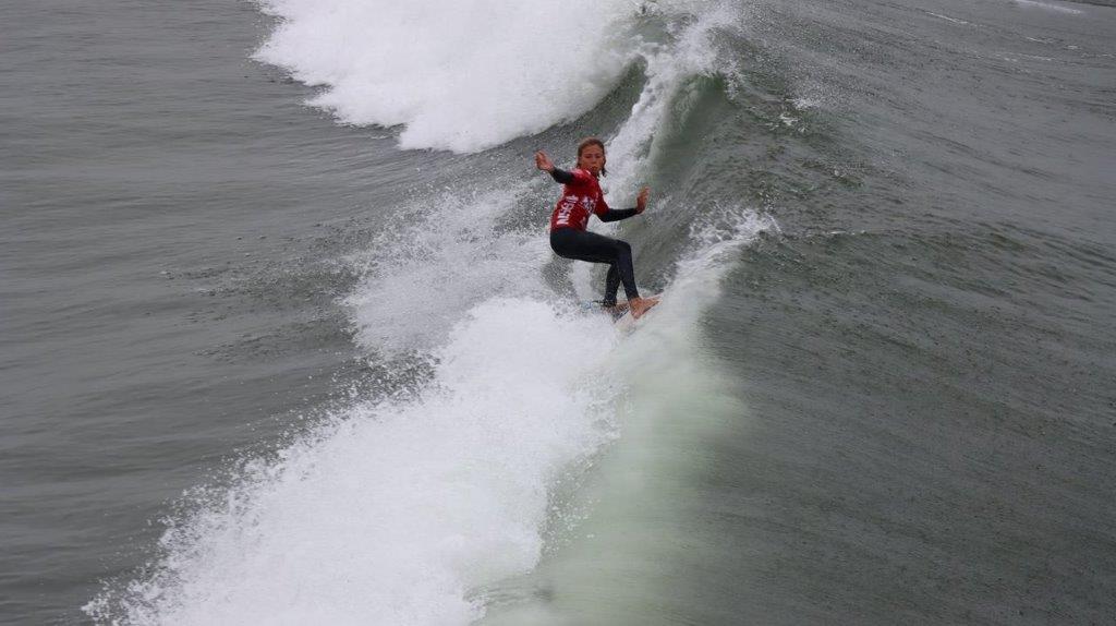 A person surfing on a wave

Description automatically generated