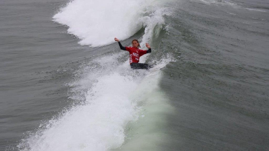 A person surfing on a wave

Description automatically generated