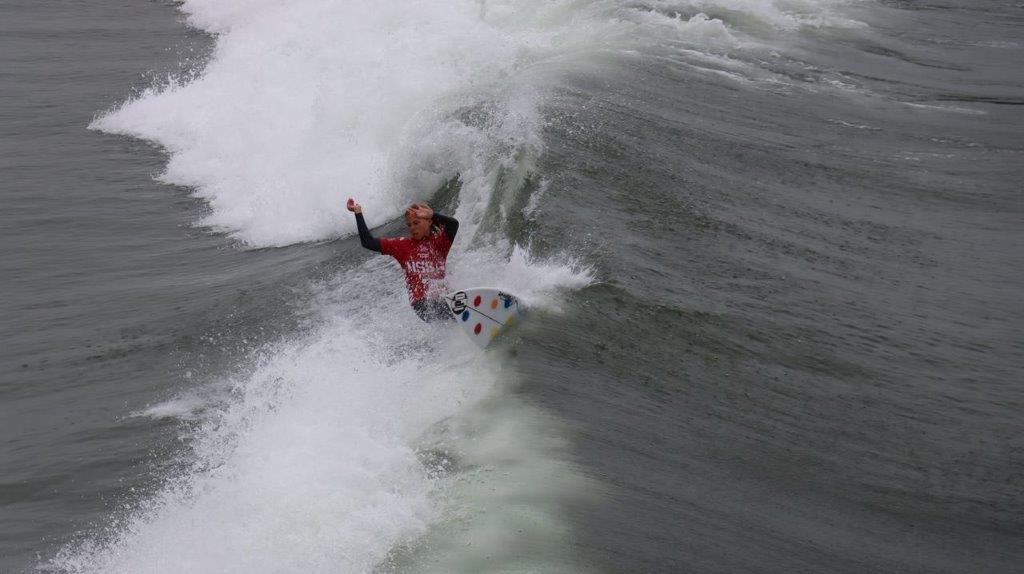 A person surfing on a wave

Description automatically generated