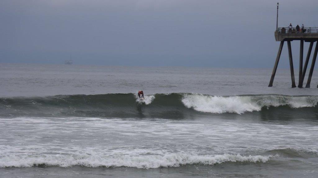 A person surfing on a wave

Description automatically generated