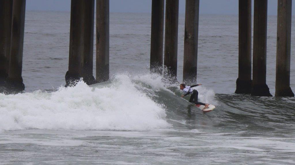 A person surfing on a wave

Description automatically generated