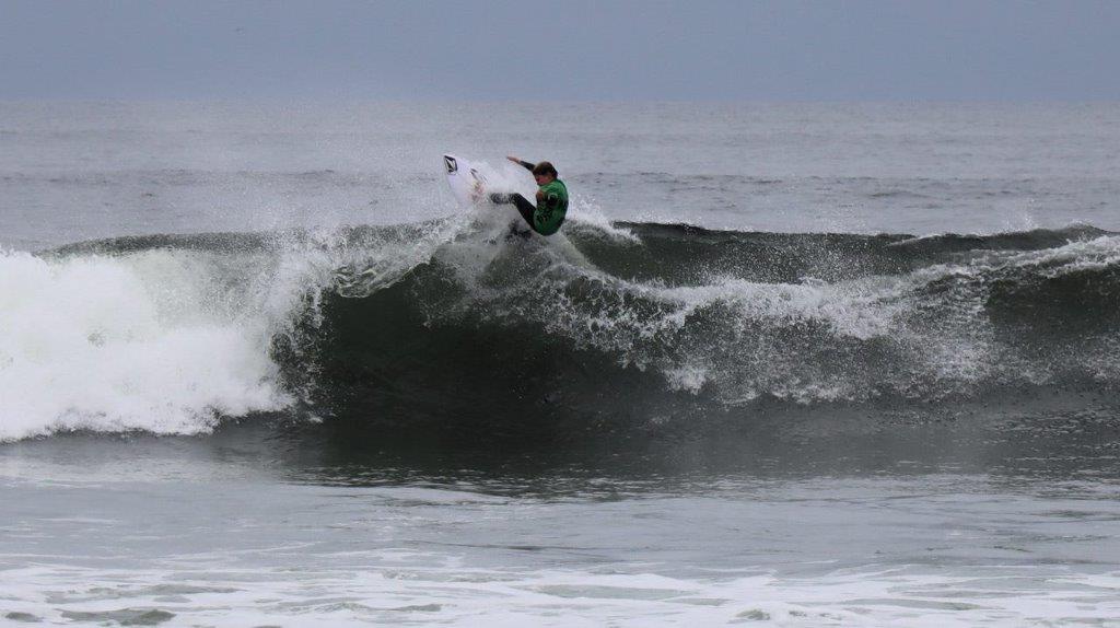 A person surfing on a wave

Description automatically generated