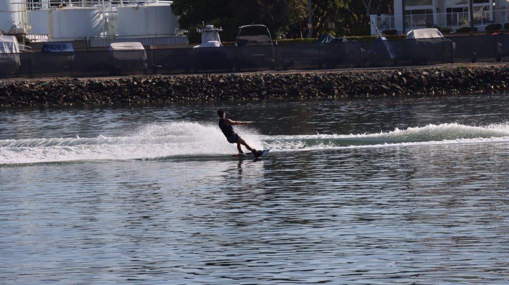A person wakeboarding on the water

Description automatically generated