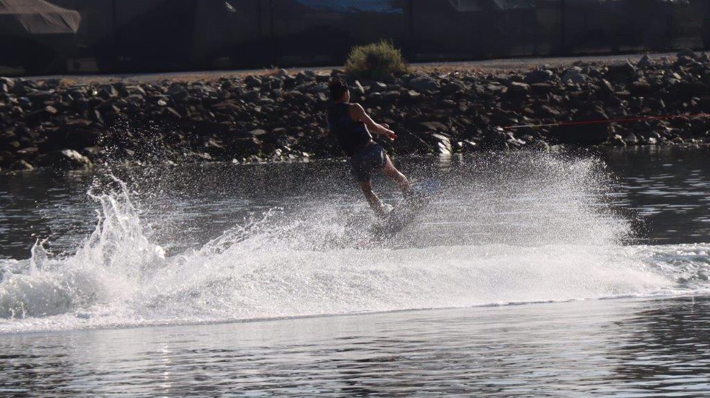 A person on a surfboard

Description automatically generated